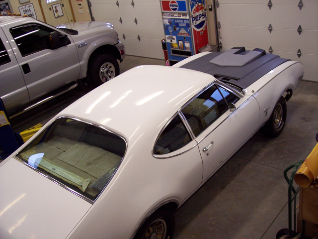 1969 Oldsmobile Cutlass removing all the glass for a complete restoration.